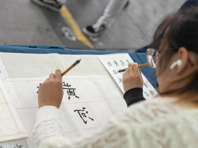 student writing japanese characters